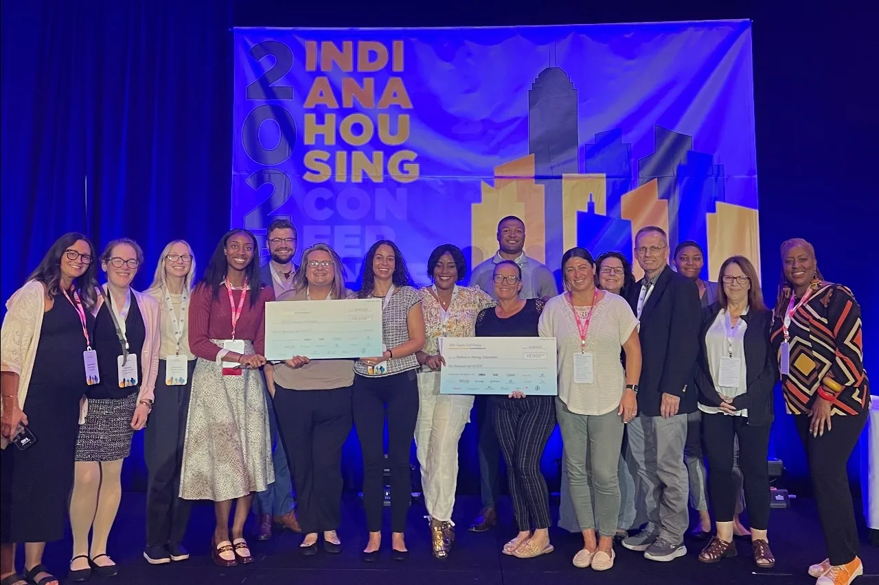 HomeNow Indy and partner staff on stage at the Indiana Housing Conference